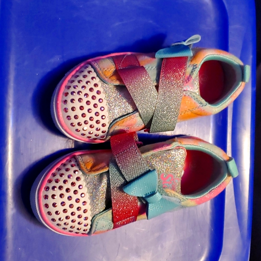 Toddler sketches sneakers